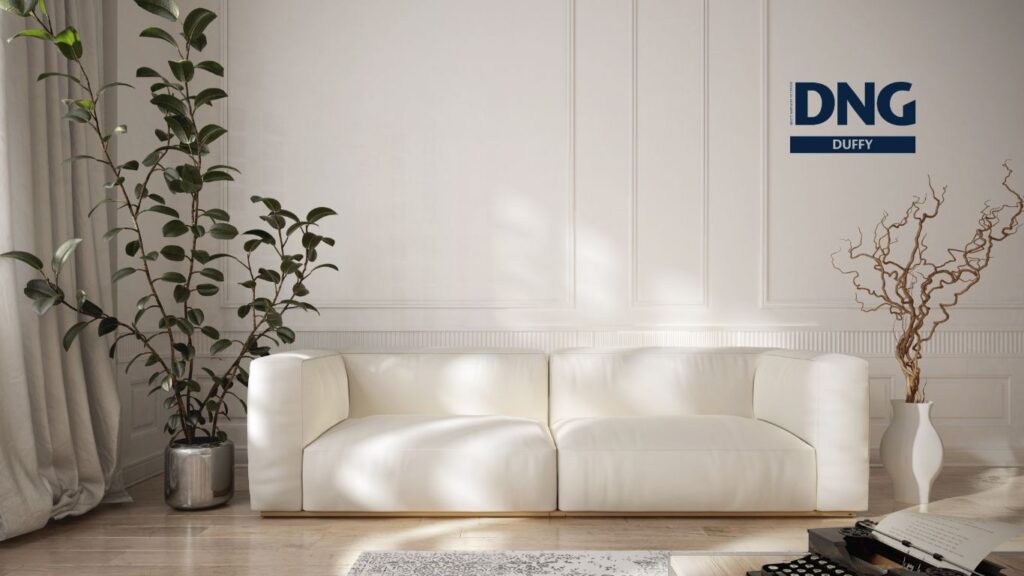 cream couch in a very well styled sitting room