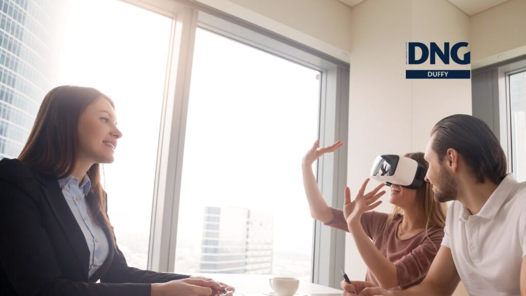 couple in VR headsets at real estate office
